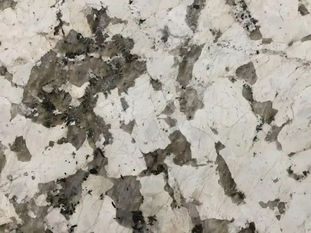 White granite countertop with gray and black mottled patterns.