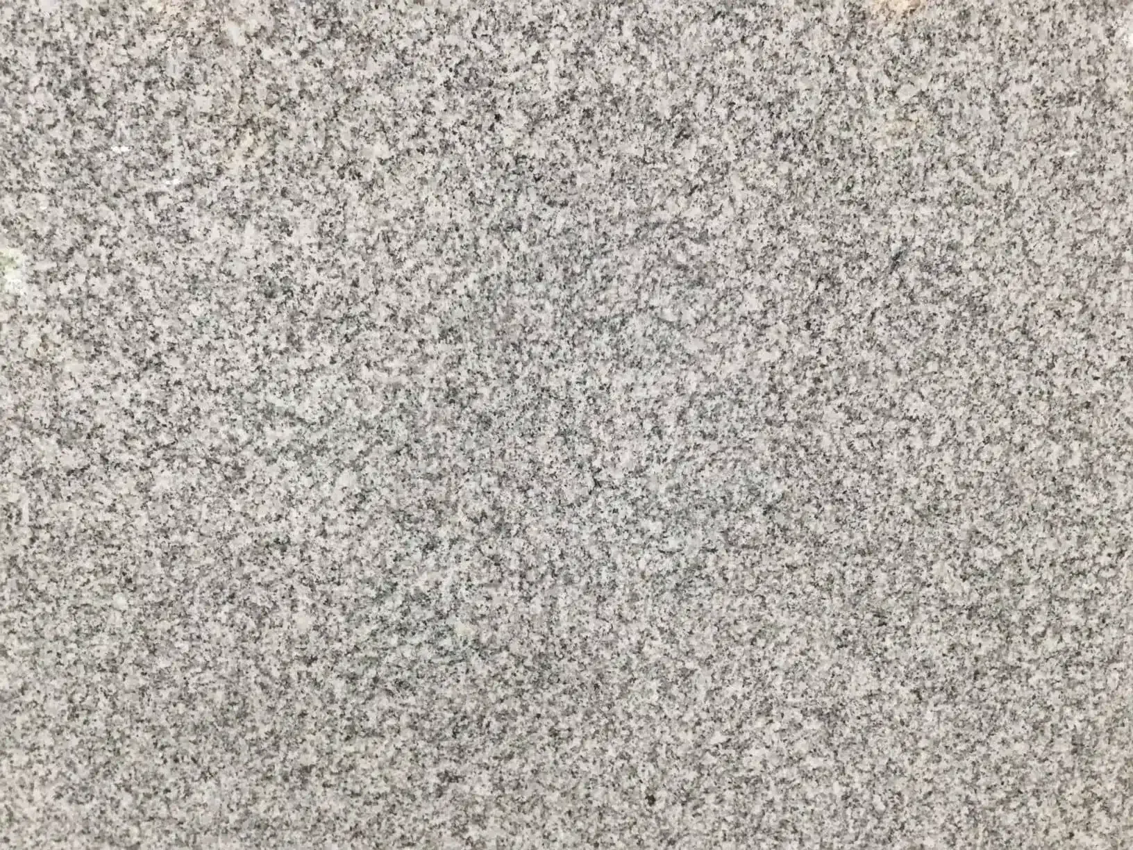 Gray speckled granite surface.