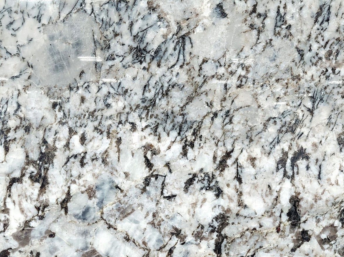 Granite countertop with speckled patterns of white, gray, and black.