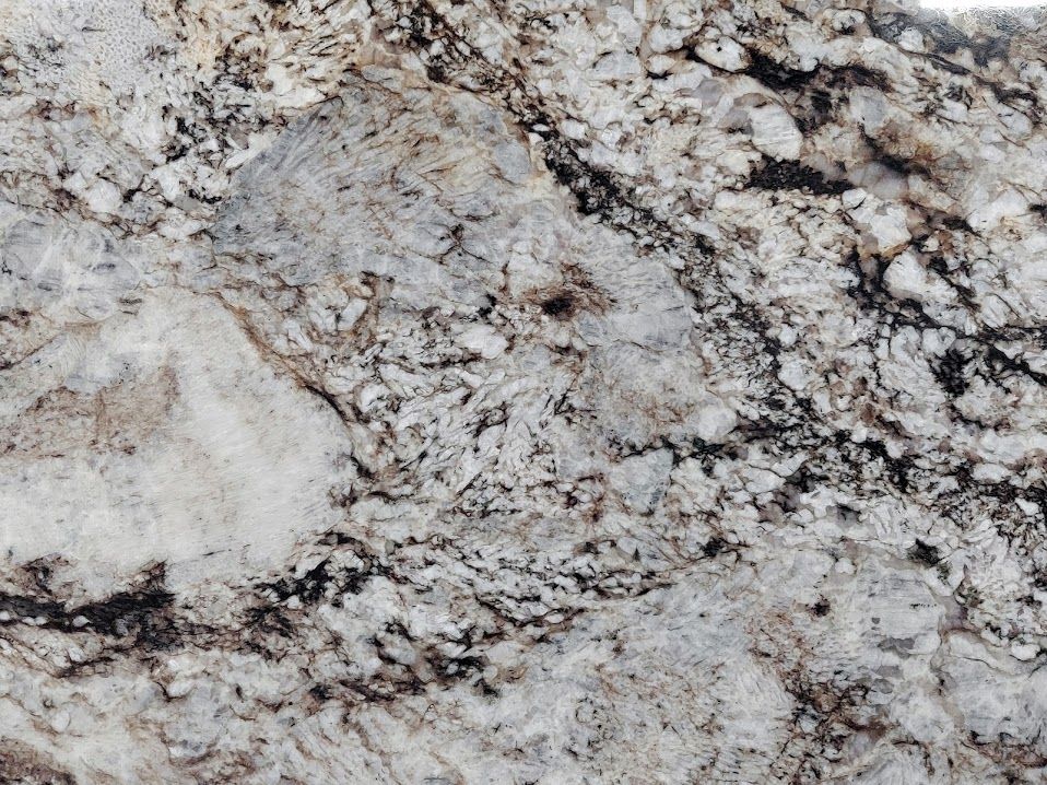 Close-up of granite countertop with swirling patterns of white, gray, and black.