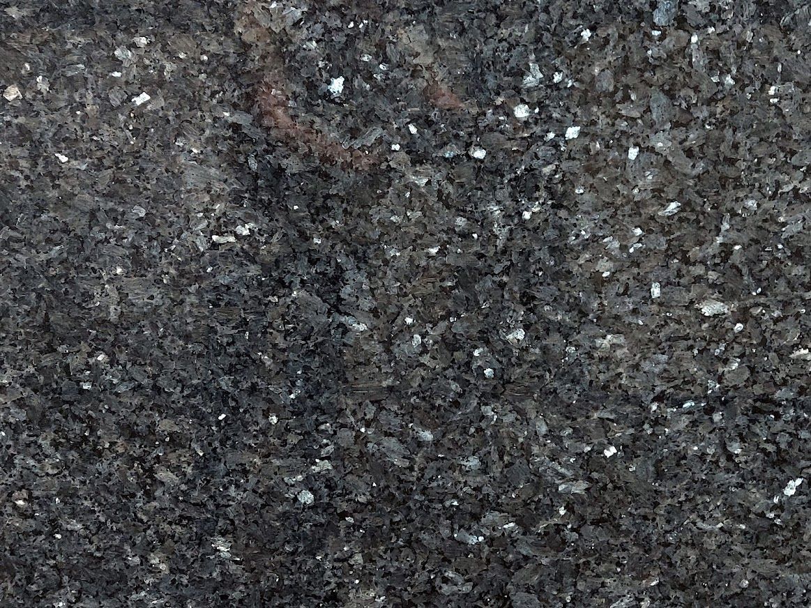Dark gray granite with flecks of white and silver.