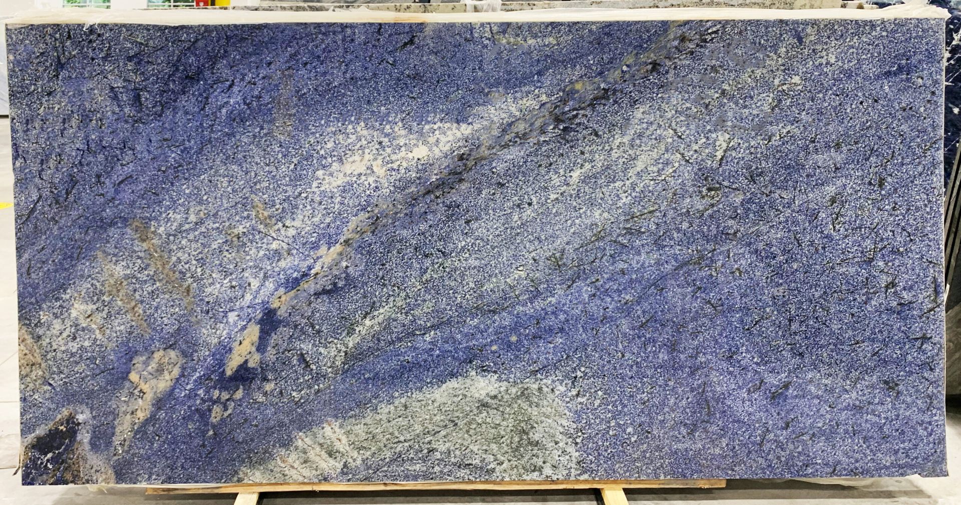 Blue granite slab with light gray and brown veining.
