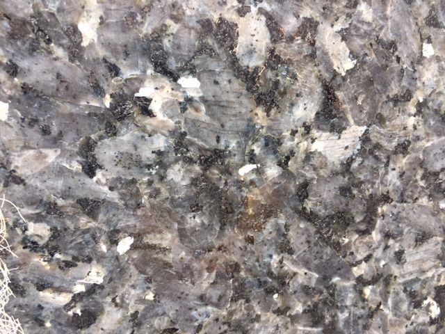 Gray and blue granite with black and white flecks.