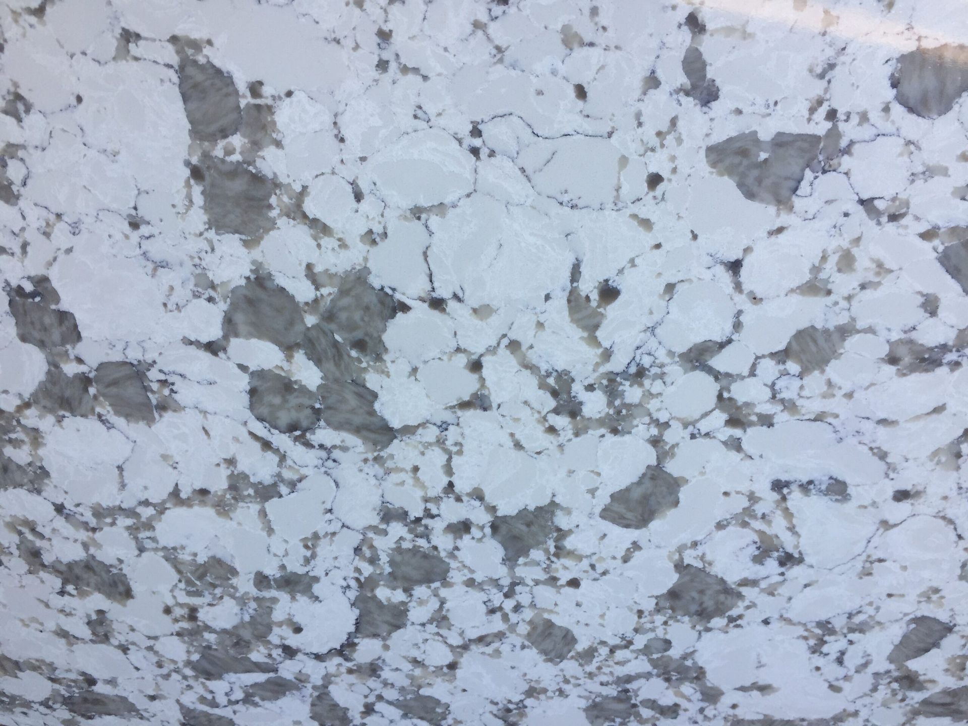 White and gray marbled stone countertop.