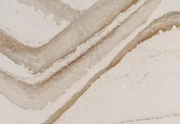 Creamy white surface with diagonal, wavy brown veining.