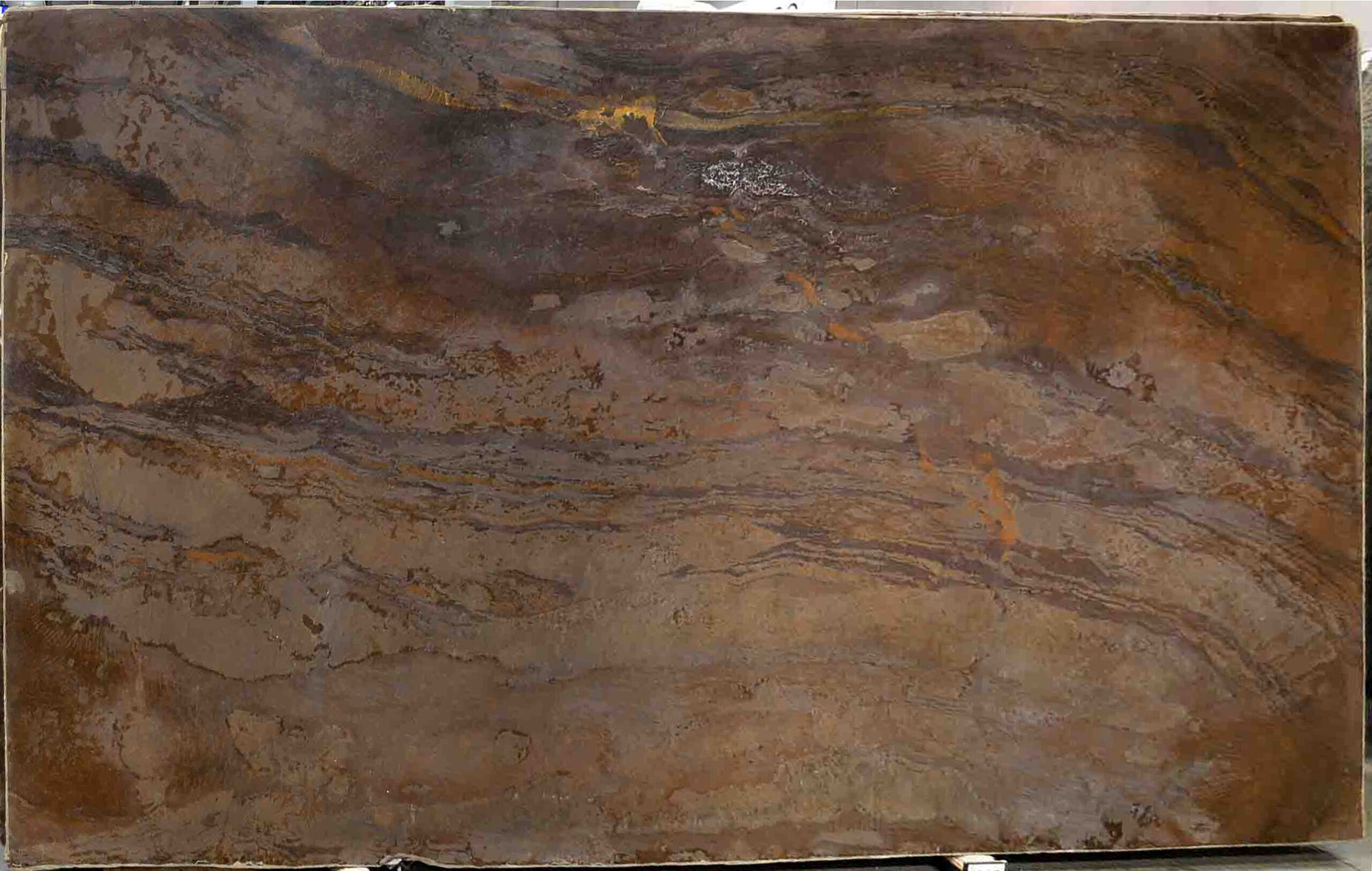 Brown and copper-toned stone slab with swirling patterns, potentially for countertops or surfaces.