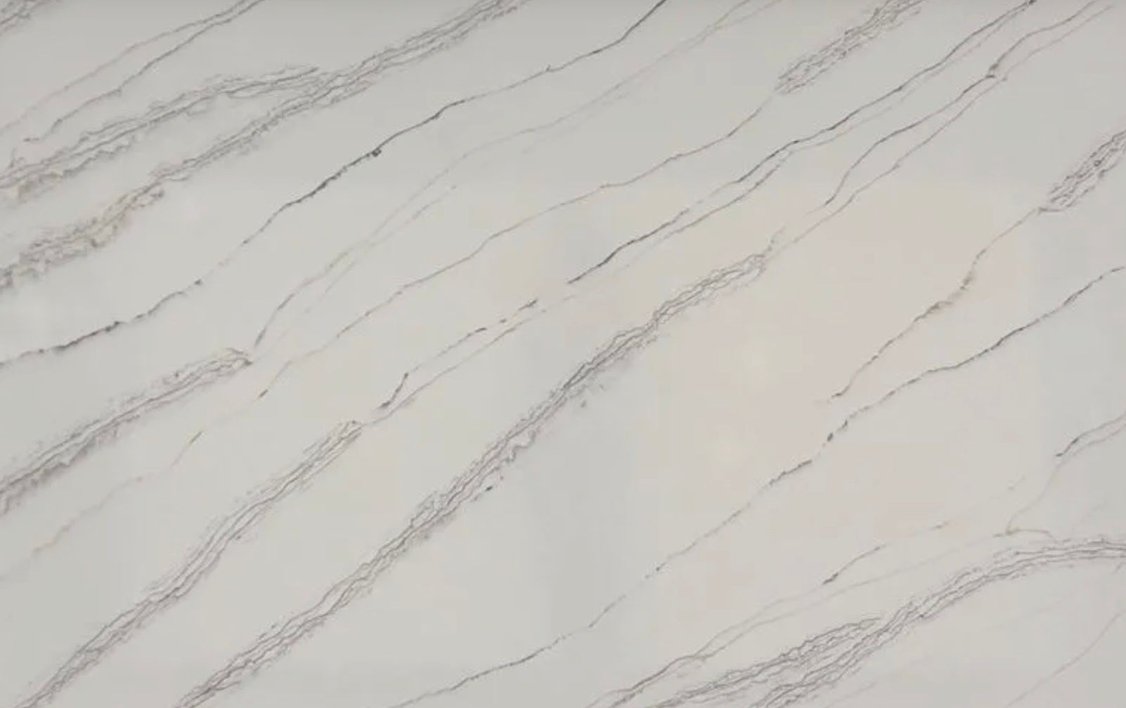 Cream-colored countertop with diagonal gray veining.