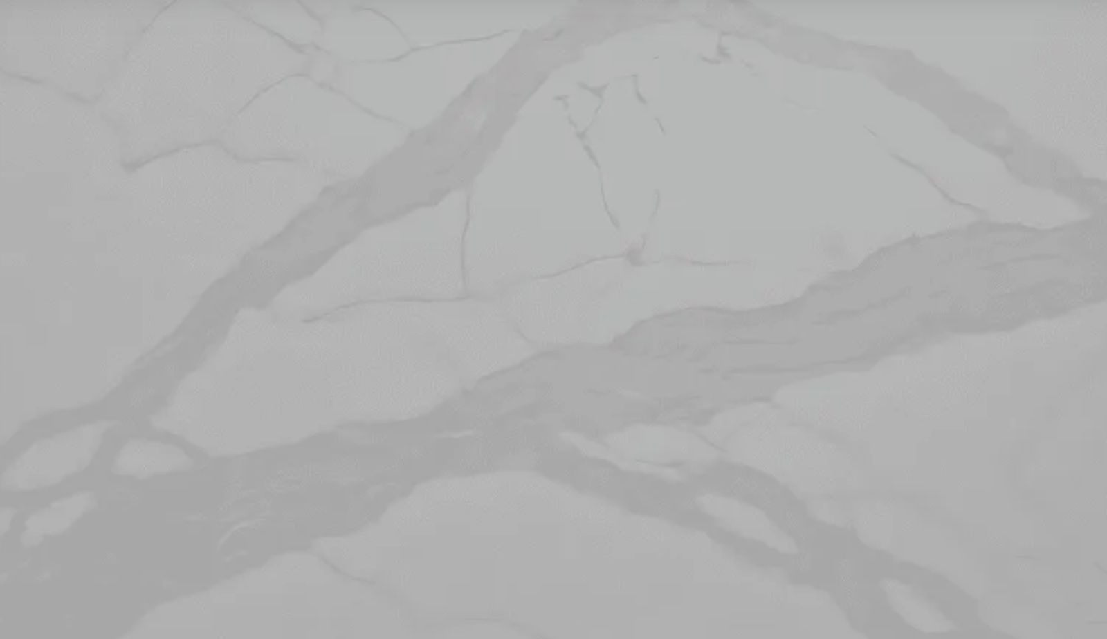 White countertop with gray veining.