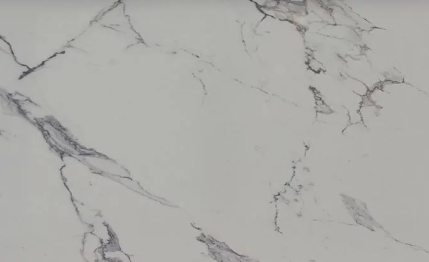 White marble surface with gray veining.