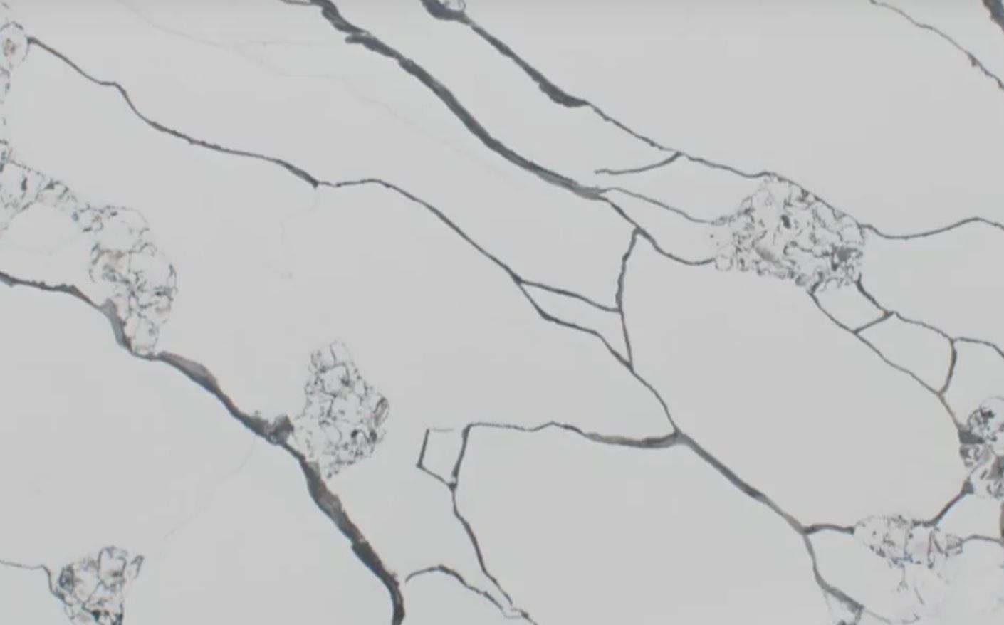 White quartz countertop with gray veining.