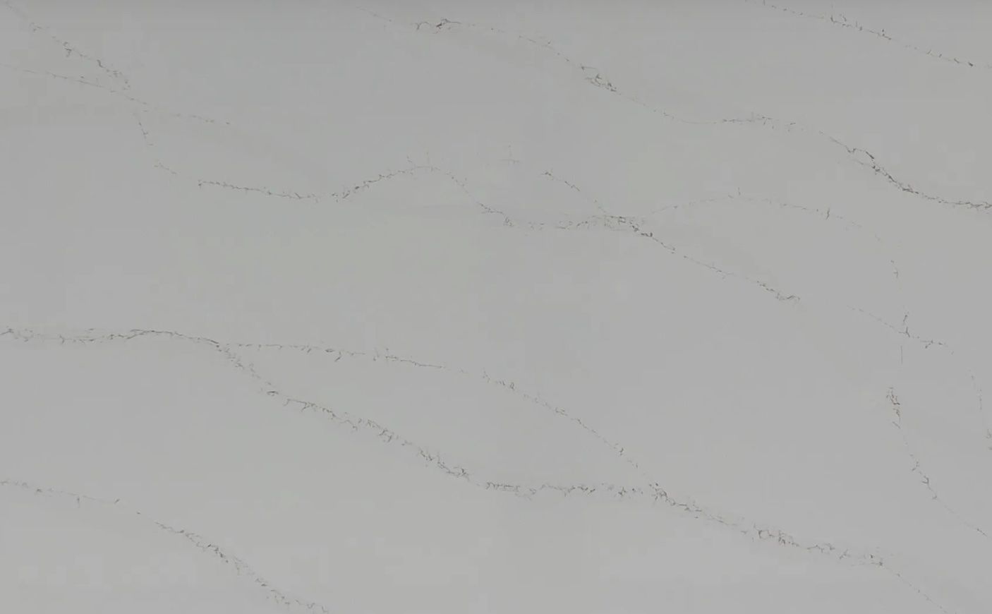 Off-white surface with light gray, curving veining.