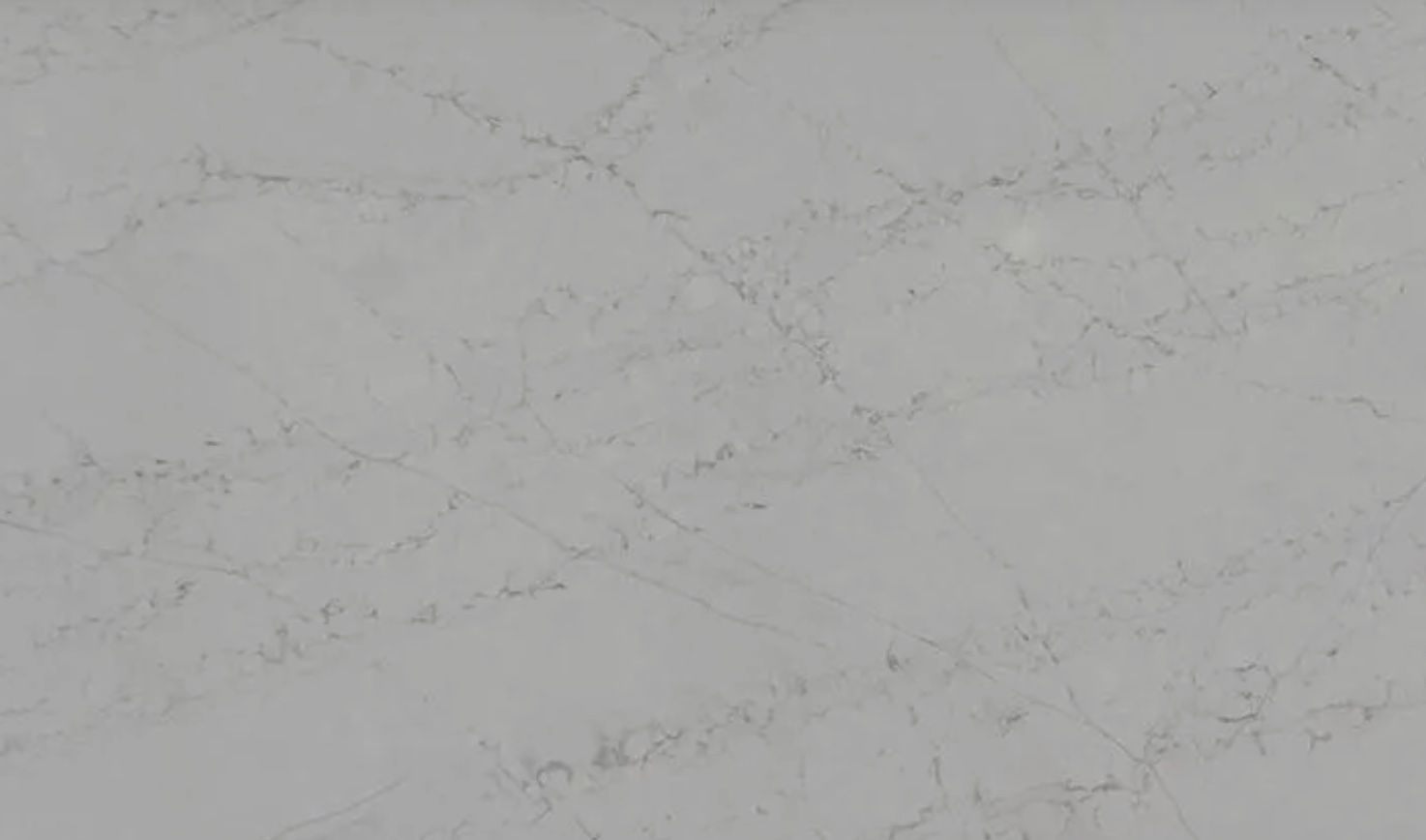 Gray quartz countertop with subtle veining.