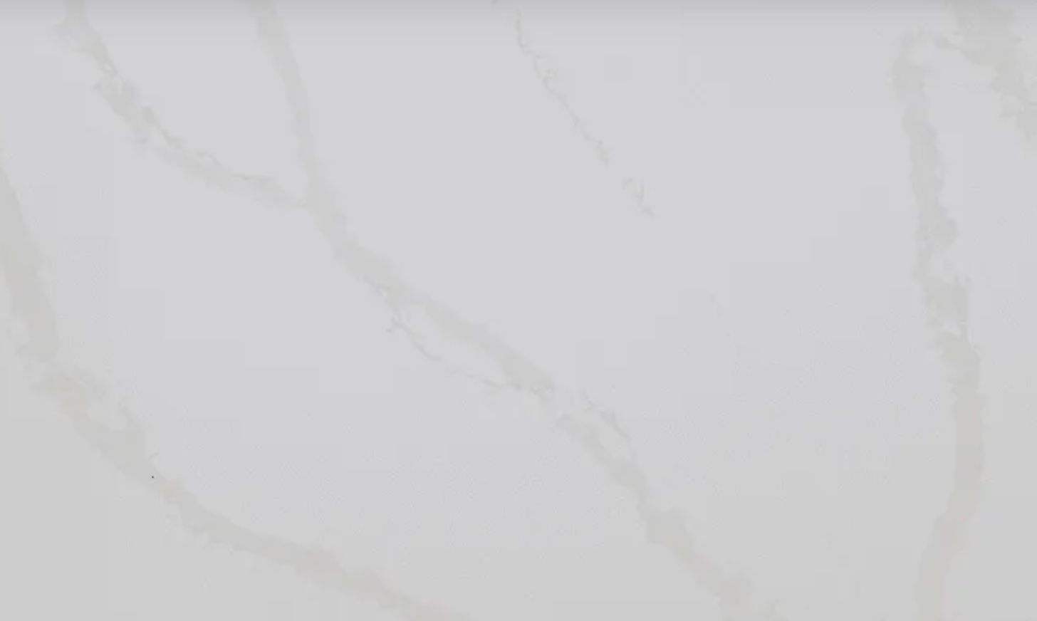 White marble surface with subtle grey veining.