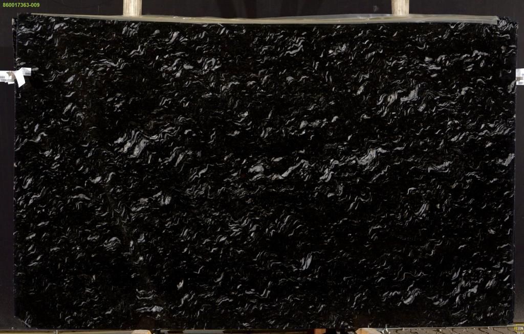 Black granite slab with textured, uneven surface.
