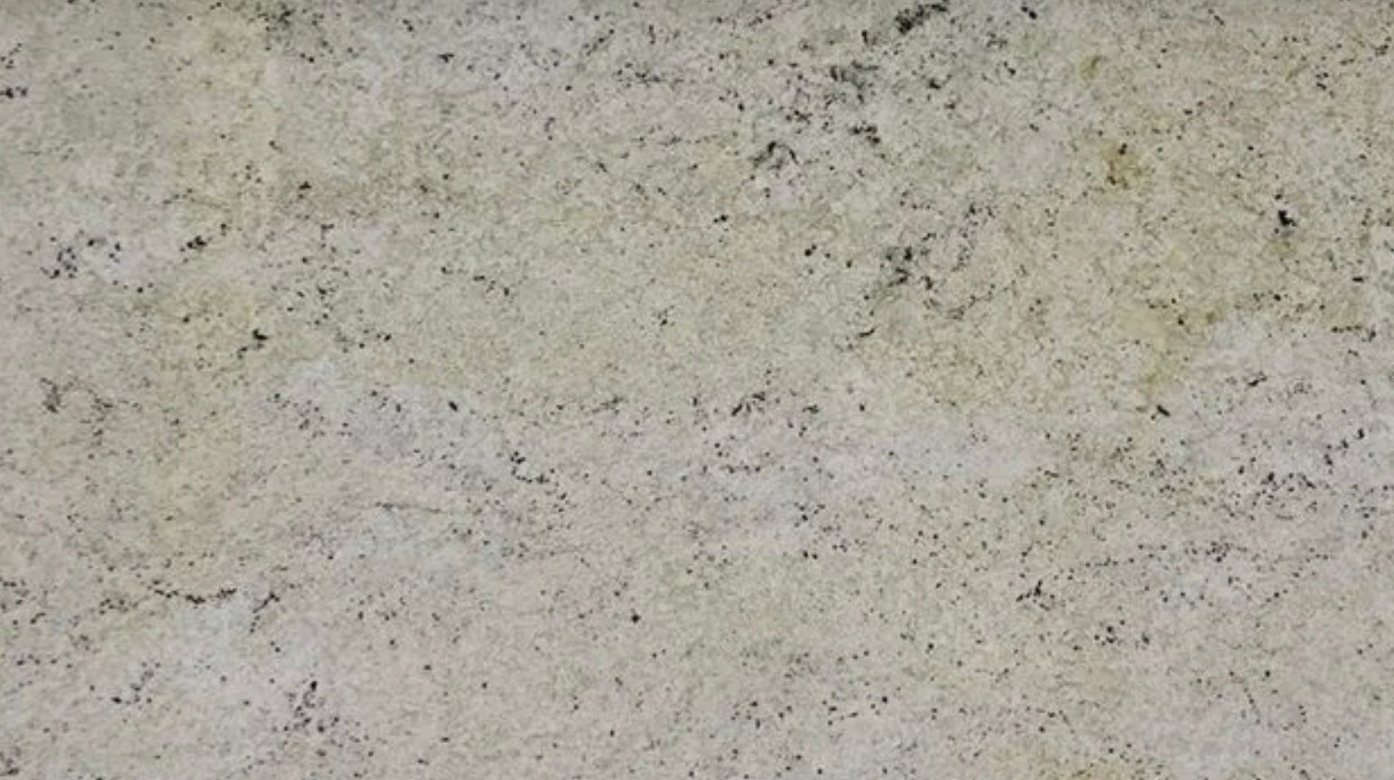 Tan and gray speckled granite surface.