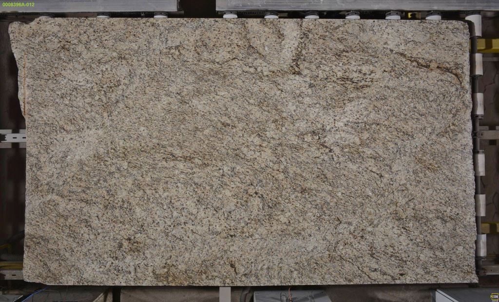 Tan granite slab with speckled texture and brown veining.