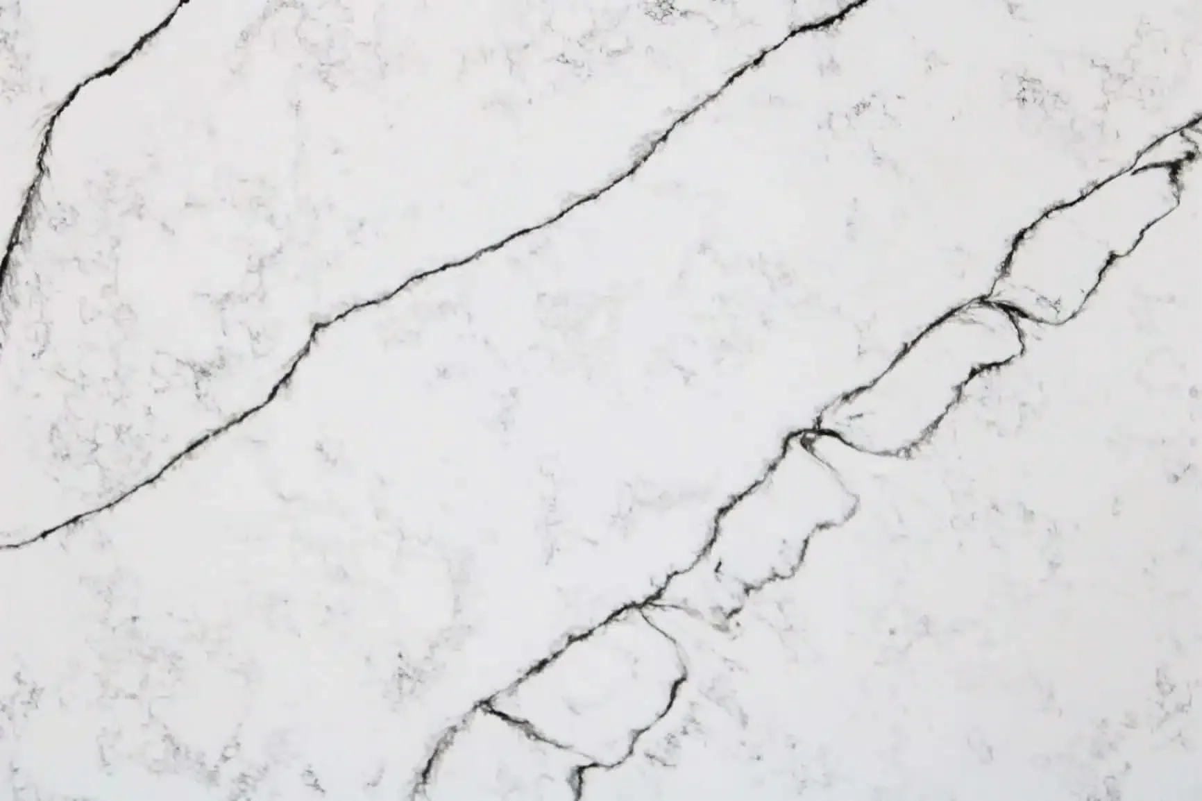 White countertop with black veining.