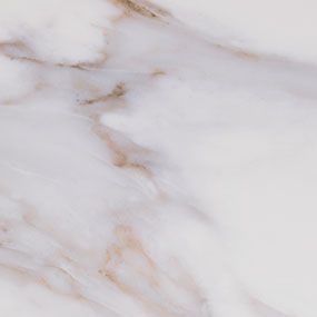 White marble with gold and brown veining.