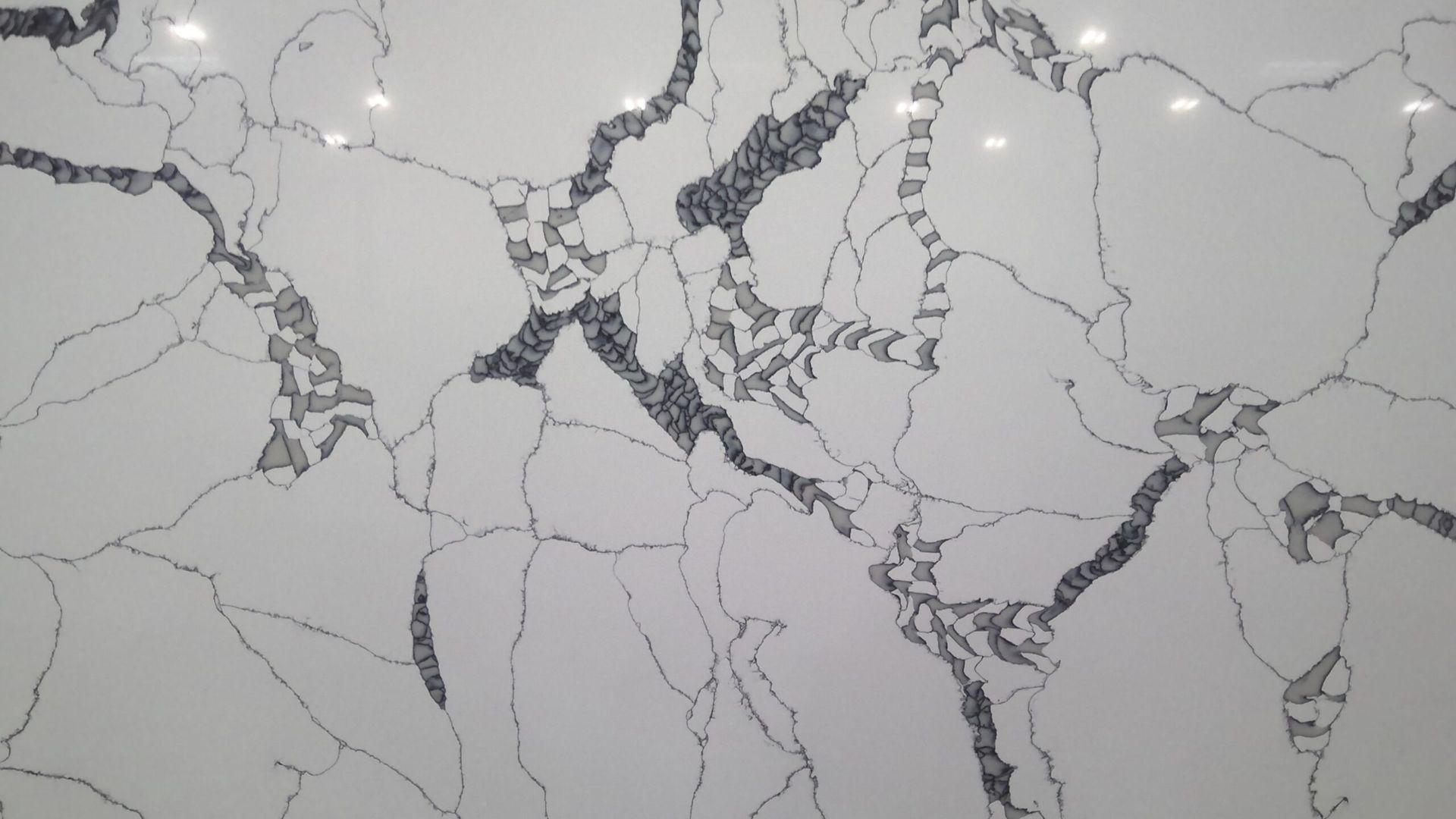 White countertop with gray and black veining.