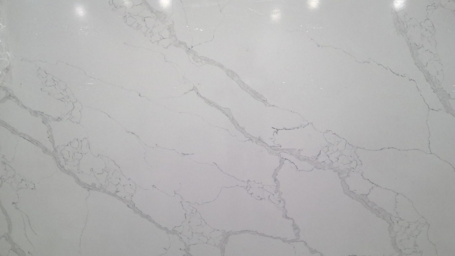 White quartz countertop with gray veining.