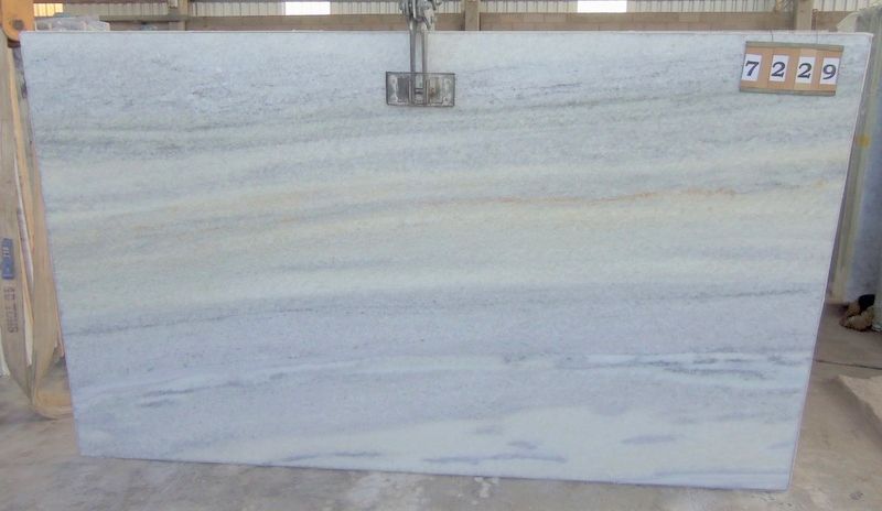 Light-colored stone slab with subtle blue and yellow veining, used for construction. Number 7229 on the right side.