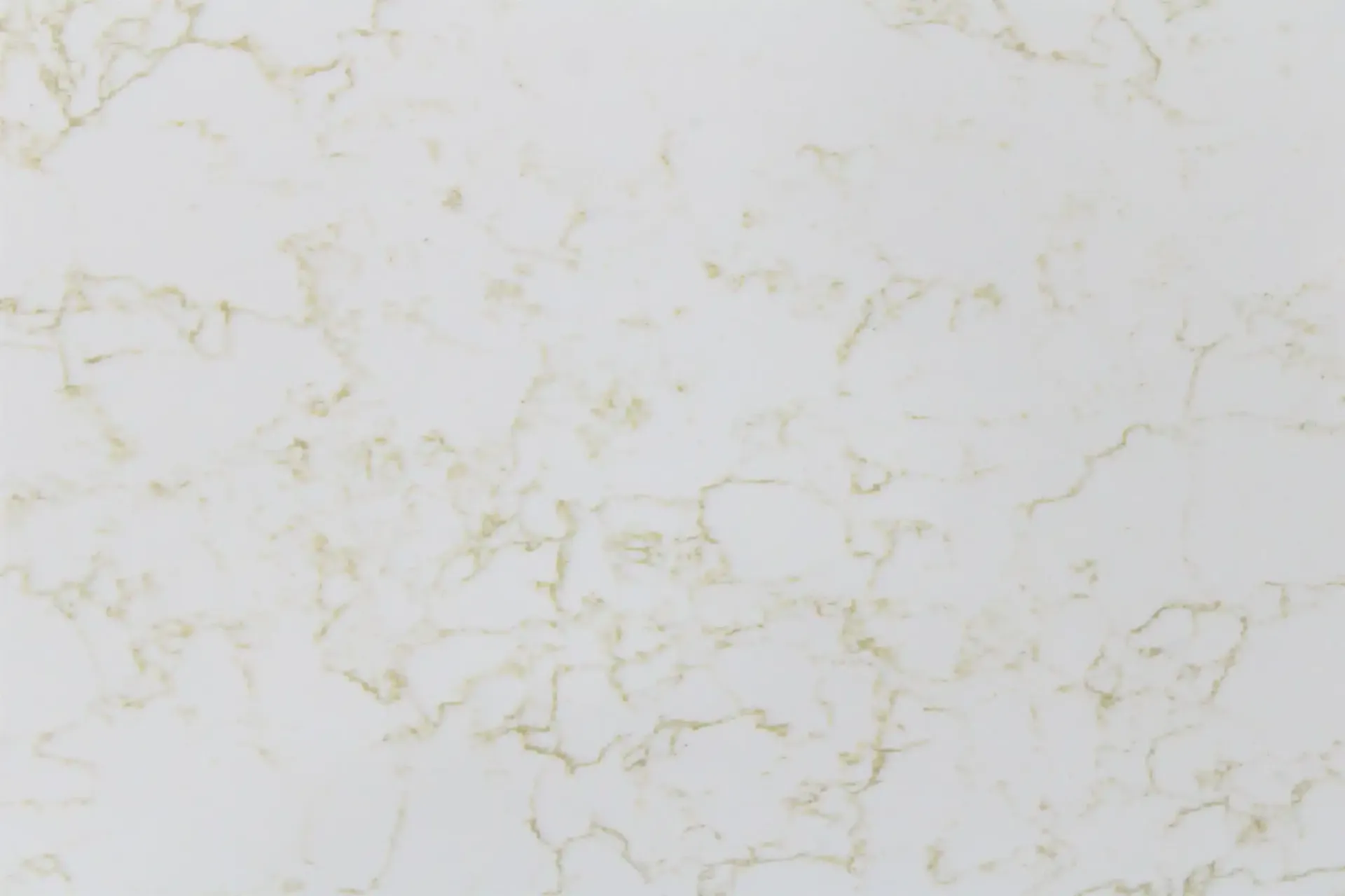 Cream-colored quartz countertop with golden veining; good for kitchen or bathroom.