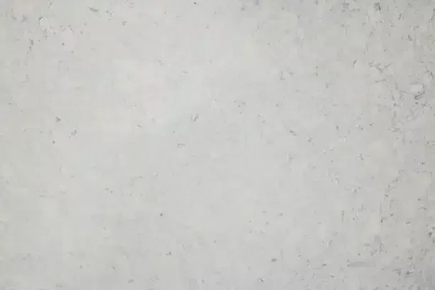 White marble surface with gray and light brown veining.