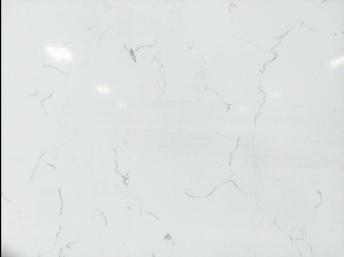 White countertop with subtle gray veining.