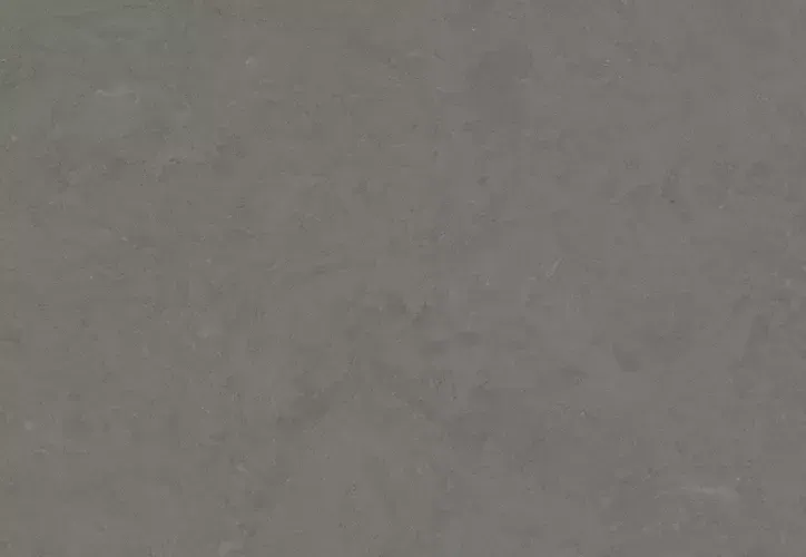 Gray stucco wall with mottled texture.