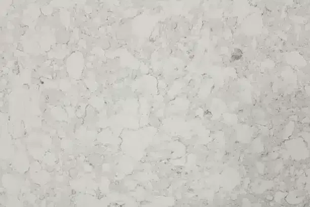 Light gray marble pattern with irregular white and darker gray blotches.