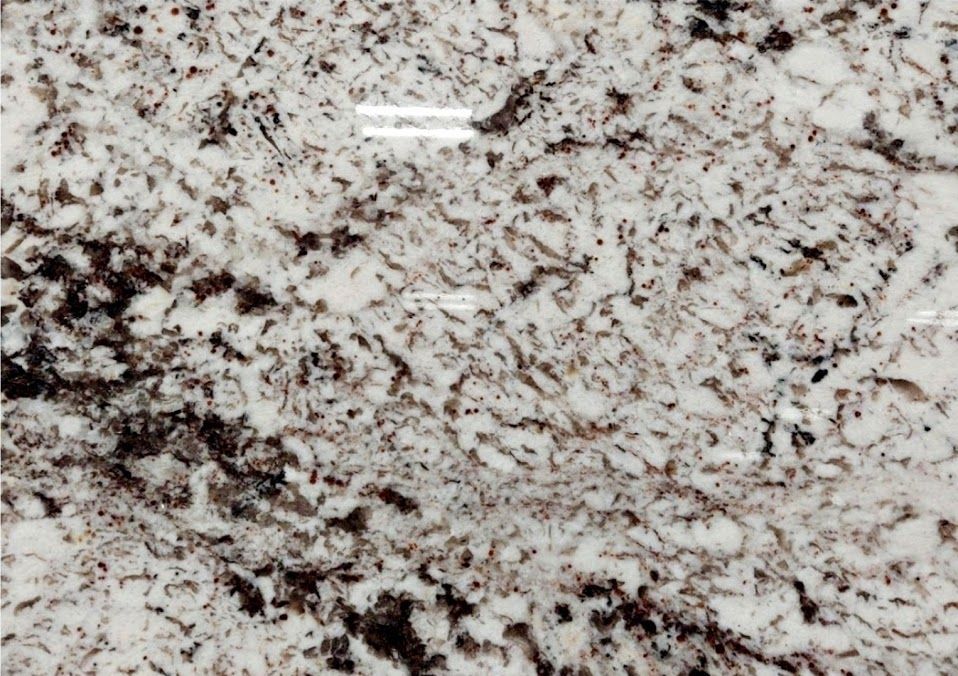 White and brown granite countertop with speckled patterns.