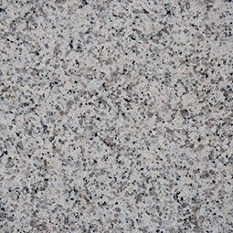 White granite countertop with speckled black, gray, and white mineral grains.