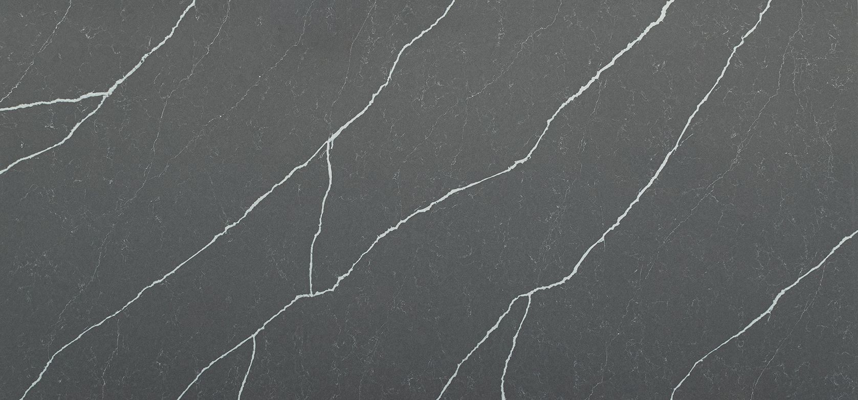 Gray surface with white veining, resembling marble or granite.