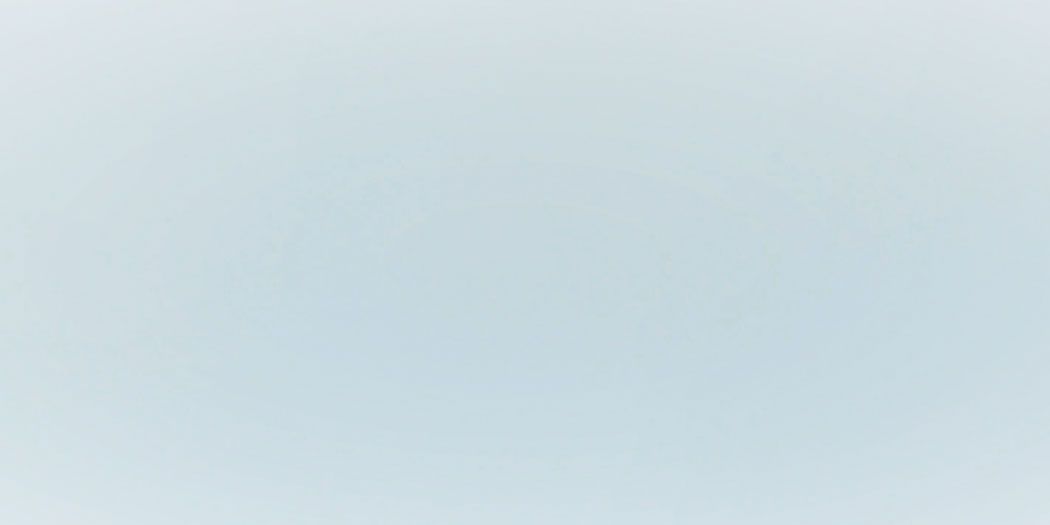 Solid light blue background.