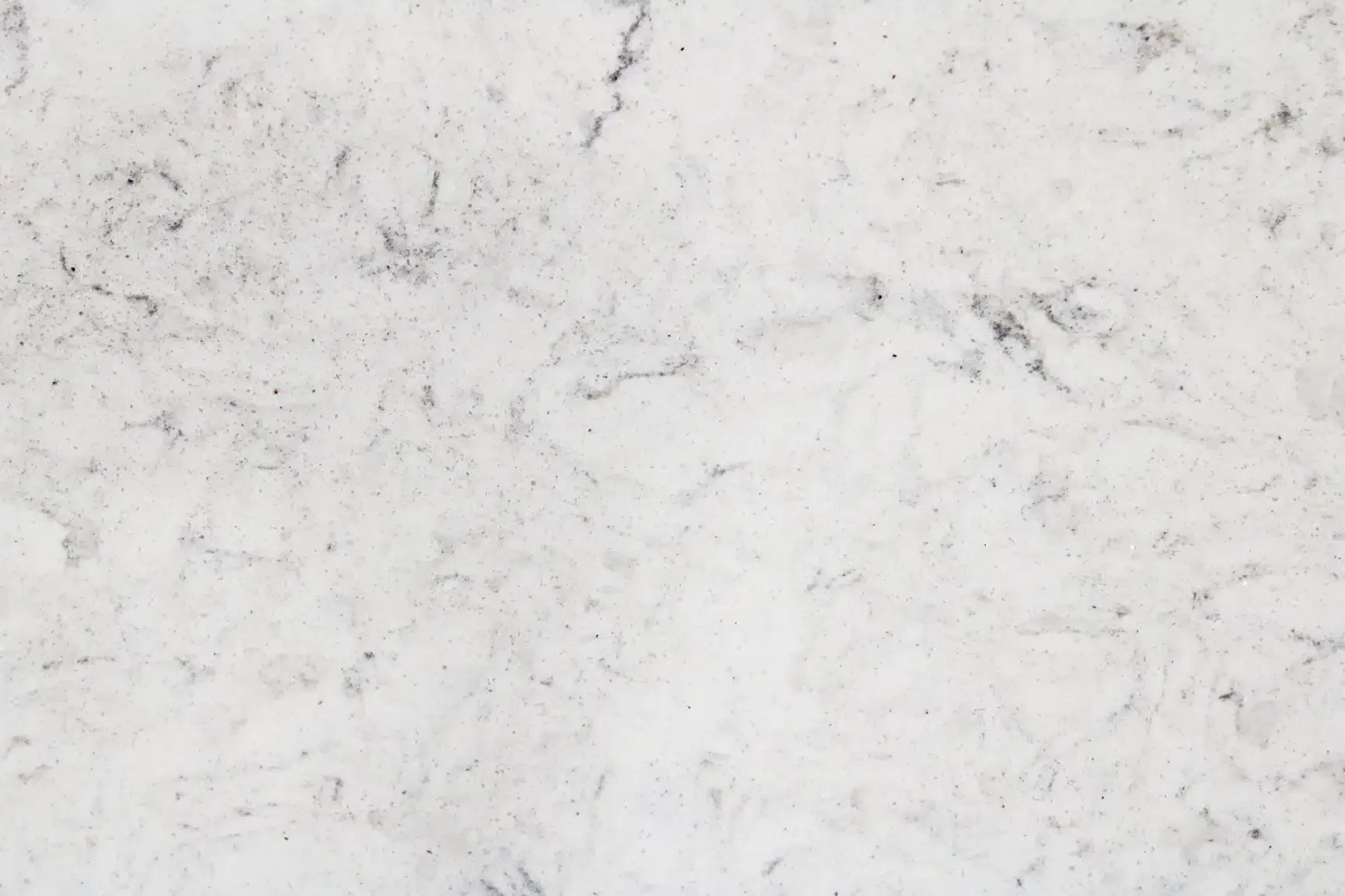 White marble countertop with subtle gray veining.