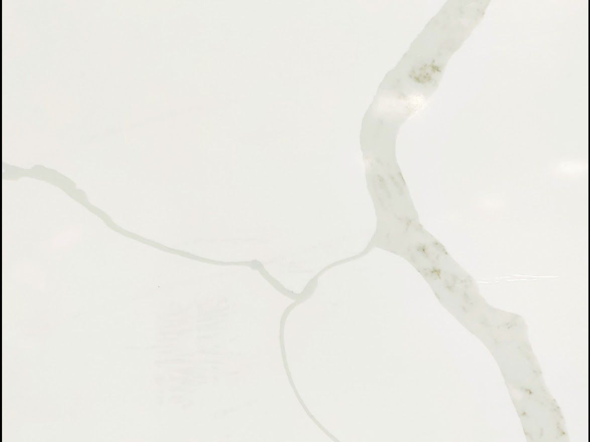 White quartz countertop with gray-gold veining.