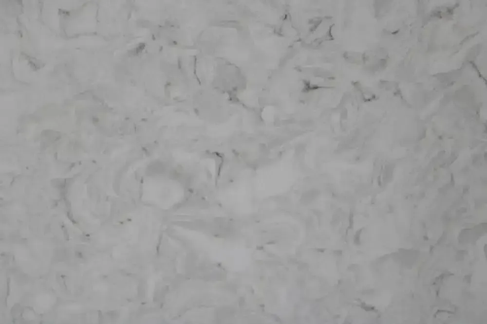 White and gray marbled surface, possibly stone or a composite material.