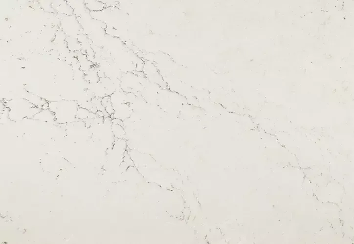 Cream-colored countertop with subtle gray veining, mimicking marble.