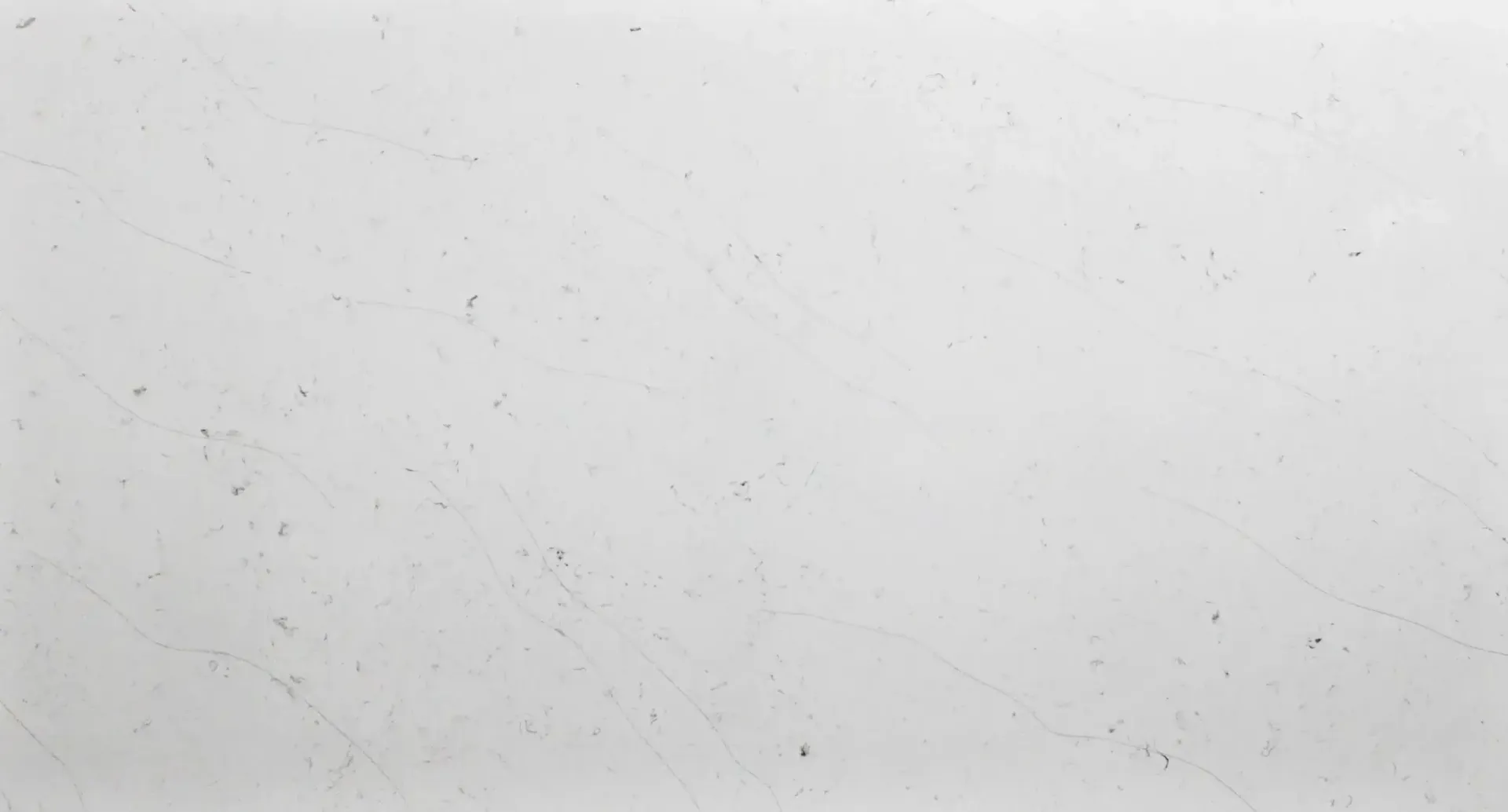 White textured wall, small dark specks.