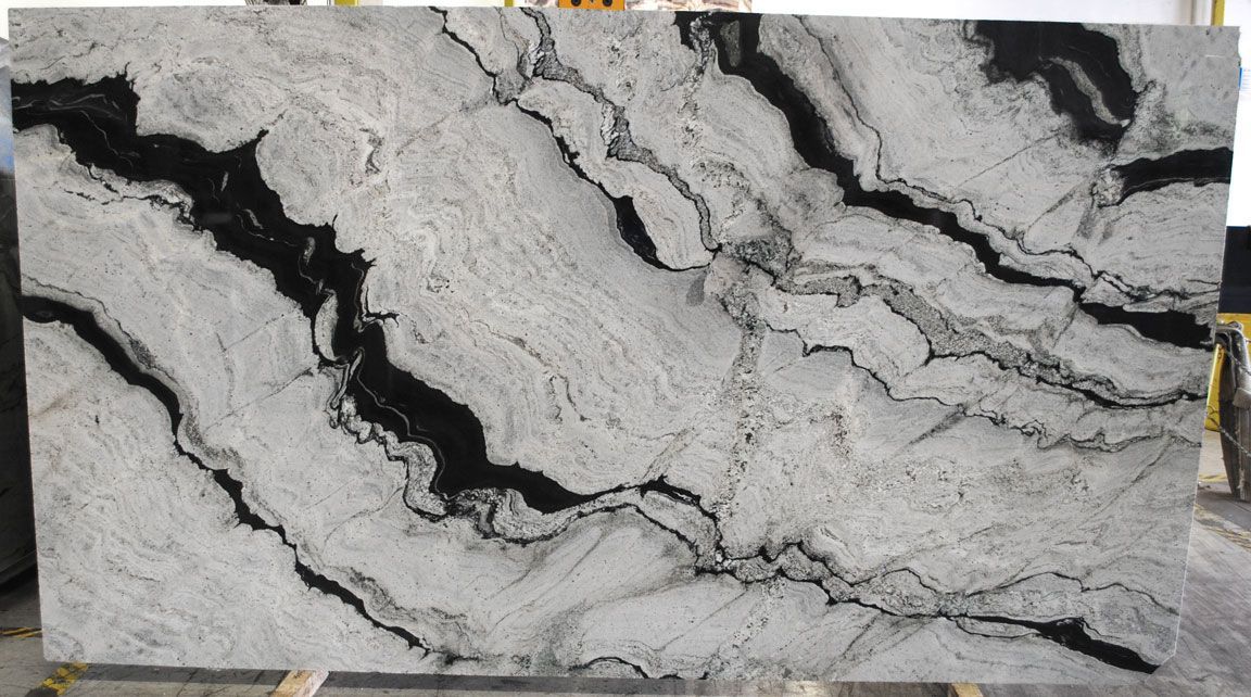 White and gray granite slab with dramatic black veining.