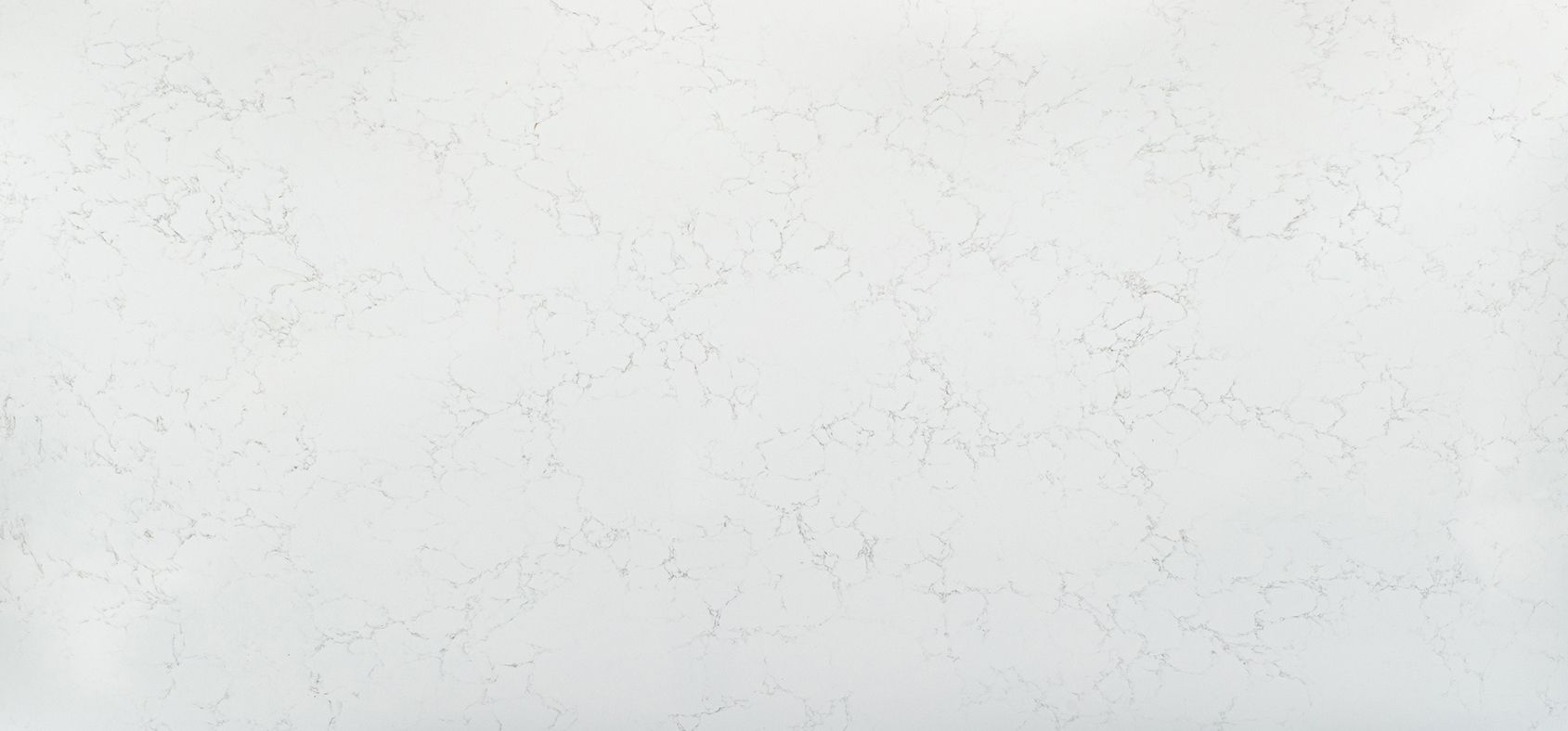 White marble countertop with subtle gray veining.