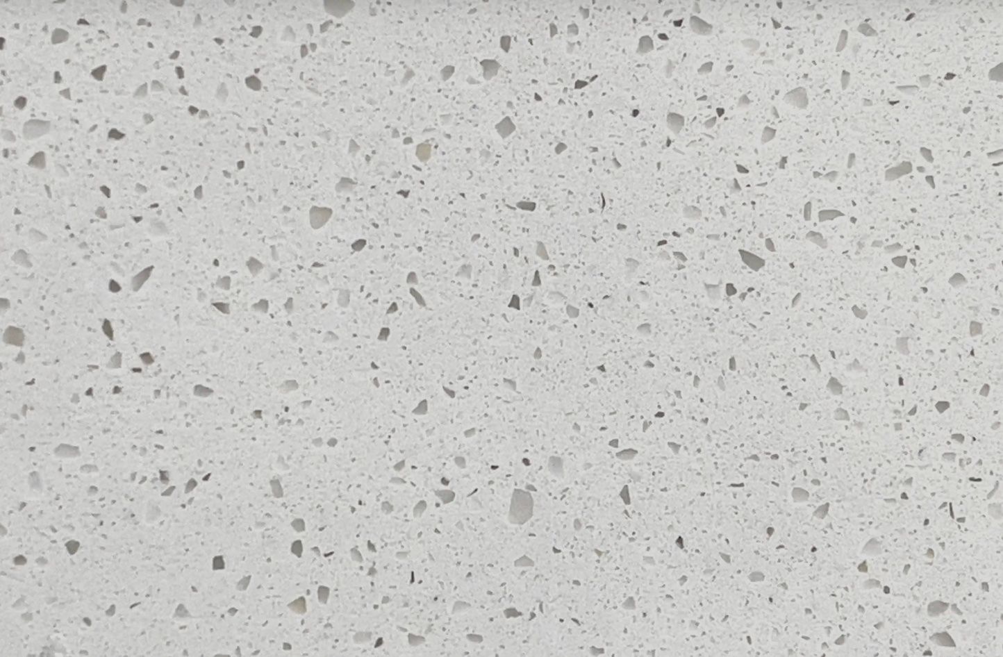 Light gray quartz countertop with speckled pattern.