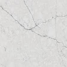 Close-up of a light-colored marble surface with gray veining and cracks throughout.