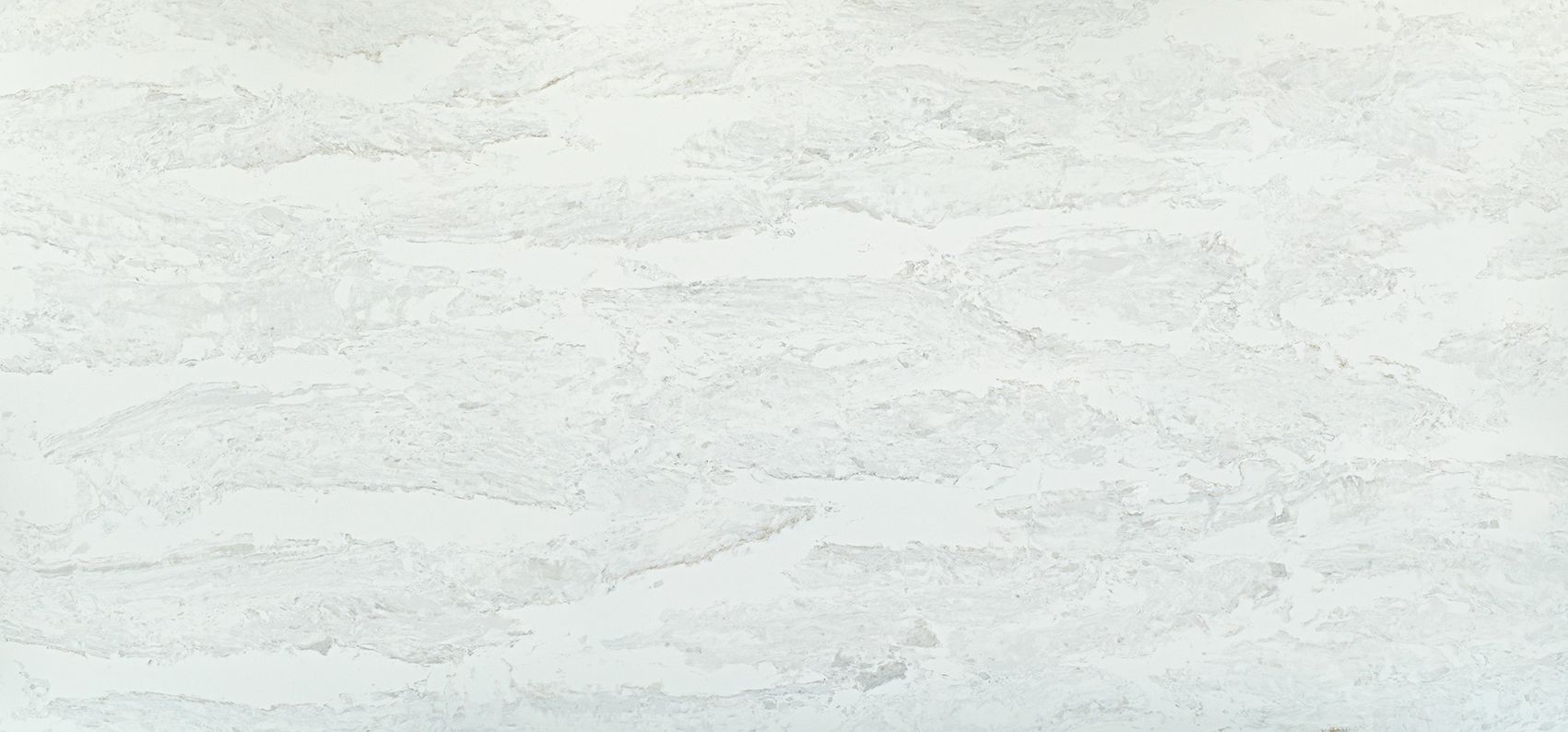 White textured surface with layered, wave-like patterns.