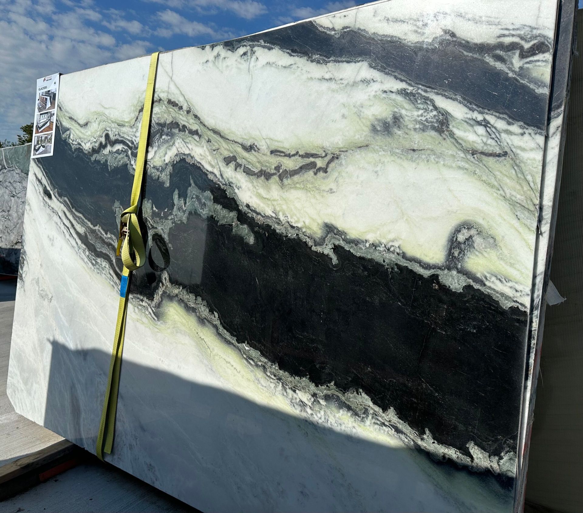 Large slab of marble, white, black and green streaks.