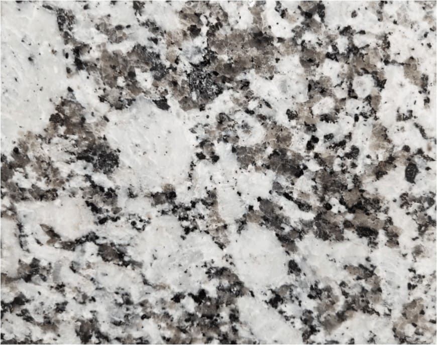 White and gray granite countertop with speckled patterns.
