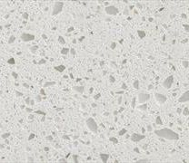 White countertop with scattered, irregular, lighter-colored flecks.