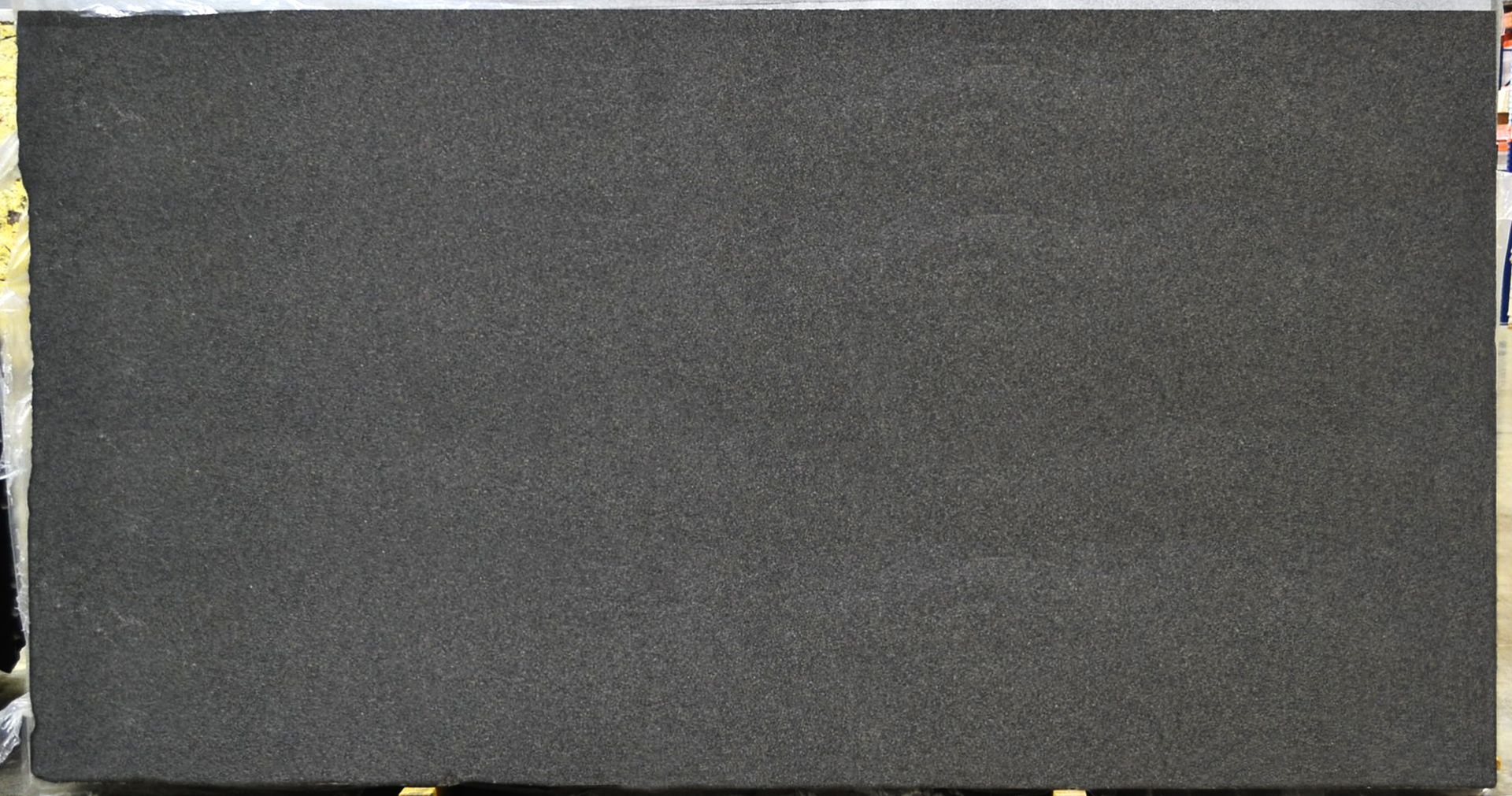 Dark gray granite countertop slab.