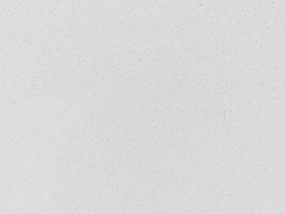 White textured surface with subtle variations in color.