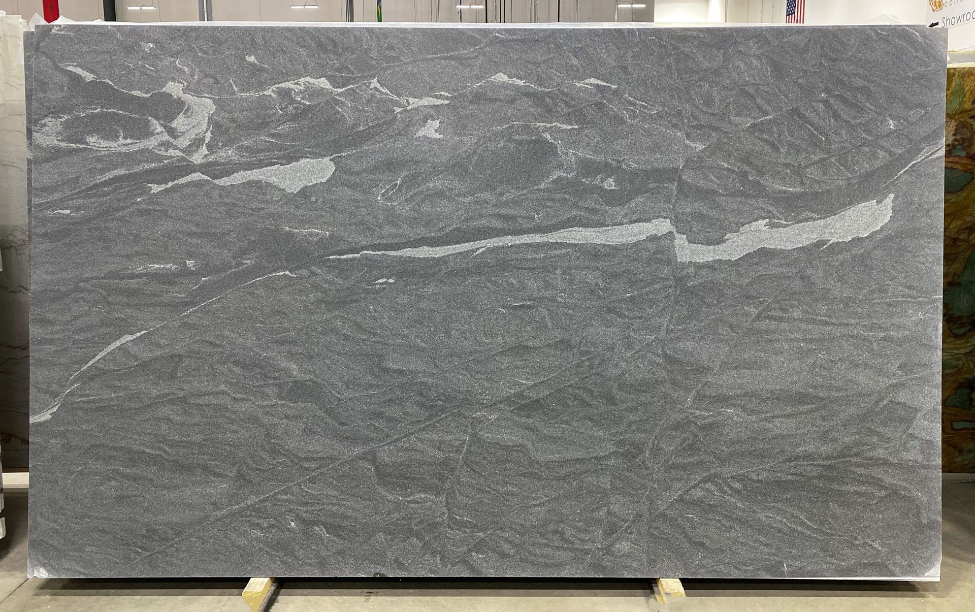 Large slab of gray granite with white and light gray veining.